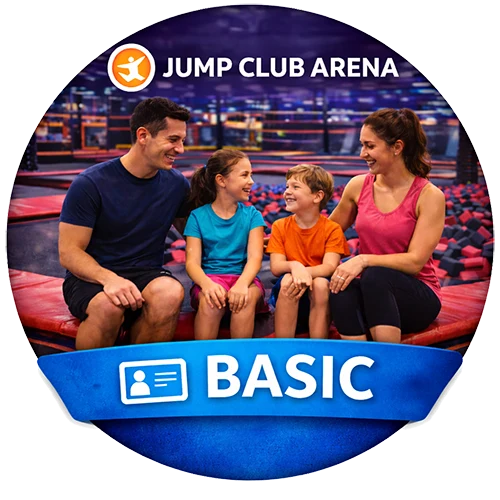 A smiling family of four sits together on a red bench at an indoor trampoline park. The image has a 