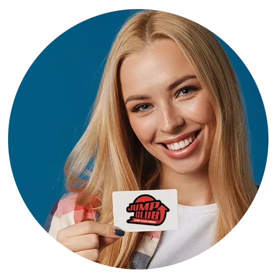 Smiling woman with long blonde hair holds a white card featuring the red and black 